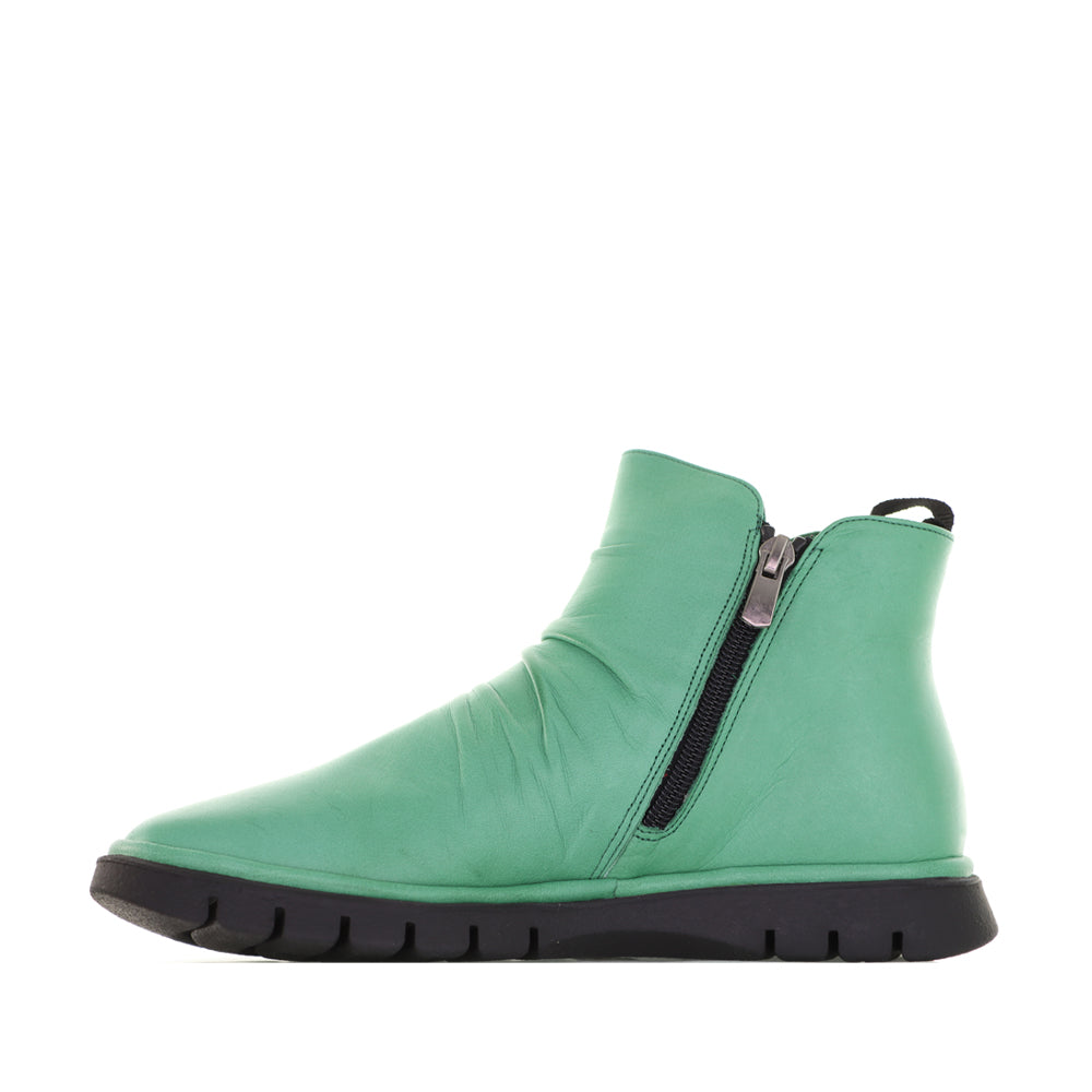 Le Sansa Rubel Jade boots featuring stylish design and comfortable fit, shown in a close-up view highlighting the leather texture.