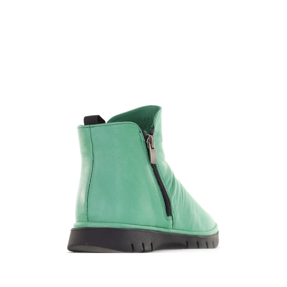 Le Sansa Rubel Jade boots with sleek design, pointed toes, and stylish leather finish, perfect for fashionable footwear.