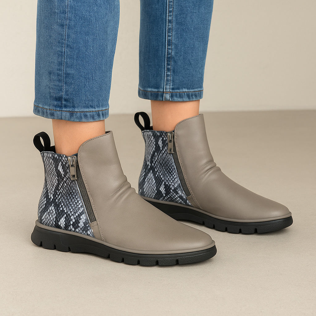 Le Sansa Rubel taupe boots with ankle-high design, featuring a sleek silhouette and stylish finish.