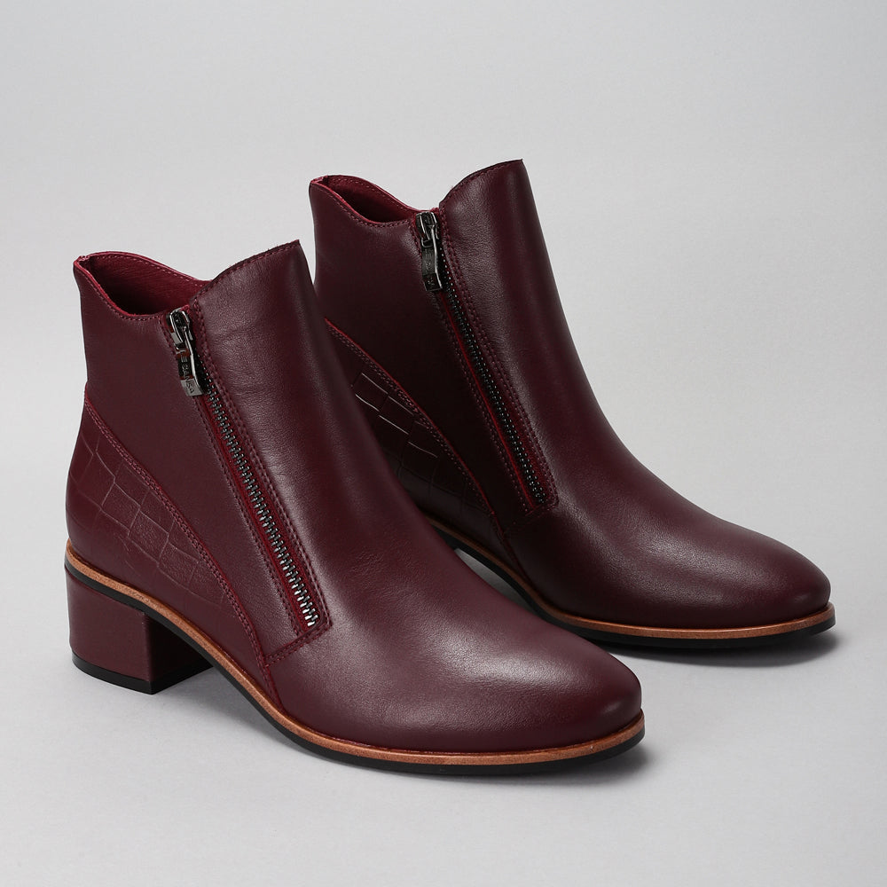 LE SANSA Refine Merlot Patent Boots with sleek maroon finish and stylish design, perfect for a sophisticated look.