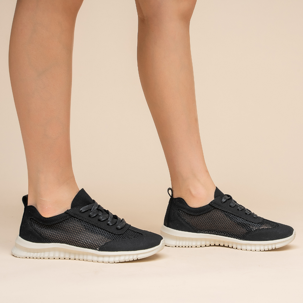 Black CC Resorts Oswald sneakers with sleek design, rubber soles, and stylish branding visible.