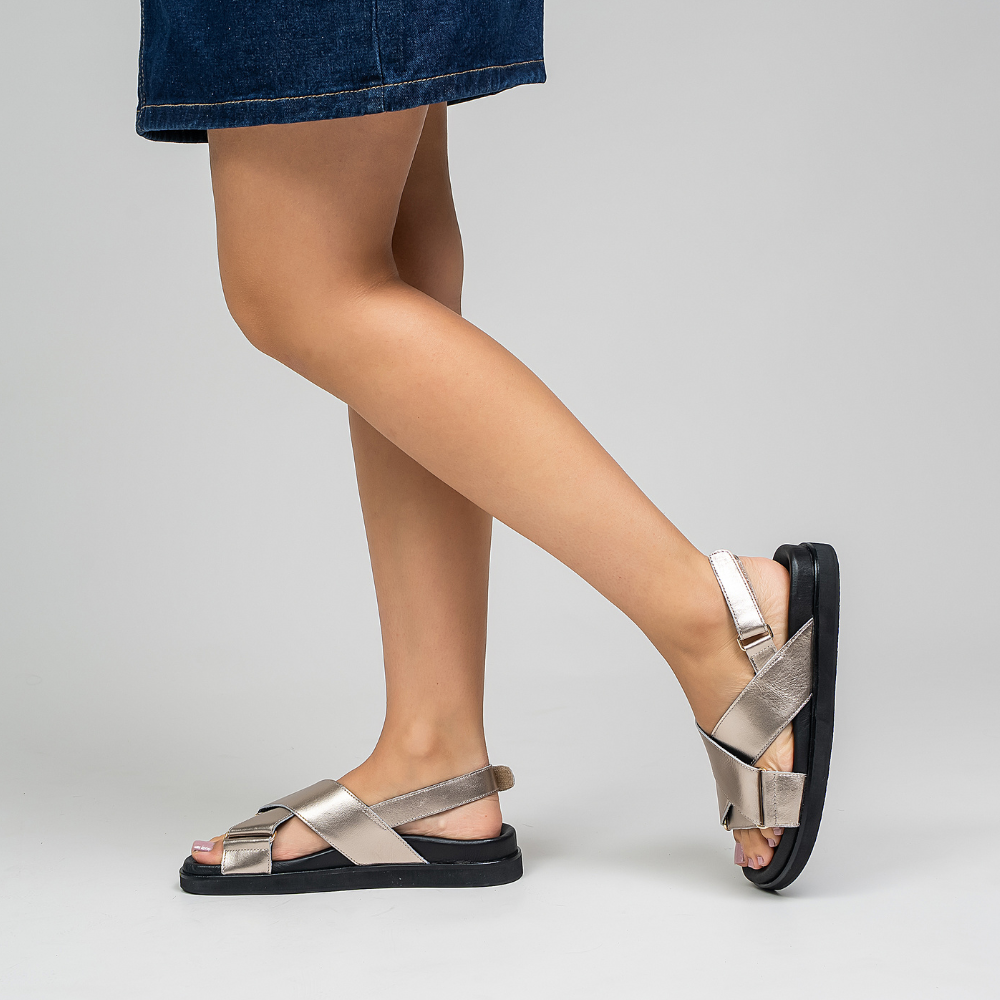 Naked Arches Marlo Champagne sandals with open toe design and ankle straps, featuring a sleek, champagne-colored finish.