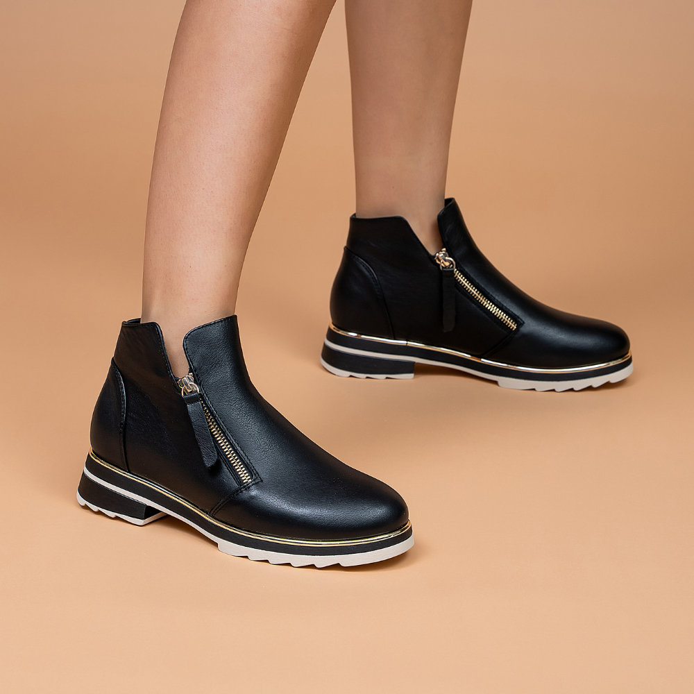 Black LE SANSA BASEL boots by Le Sansa, featuring sleek leather design and stylish ankle-high silhouette.