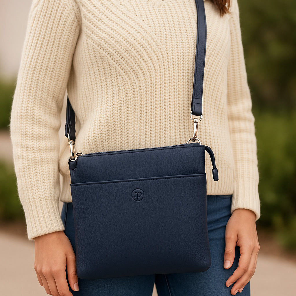 Navy blue Second Nature handbag with sleek design, top handles, and subtle branding, perfect for stylish everyday use.