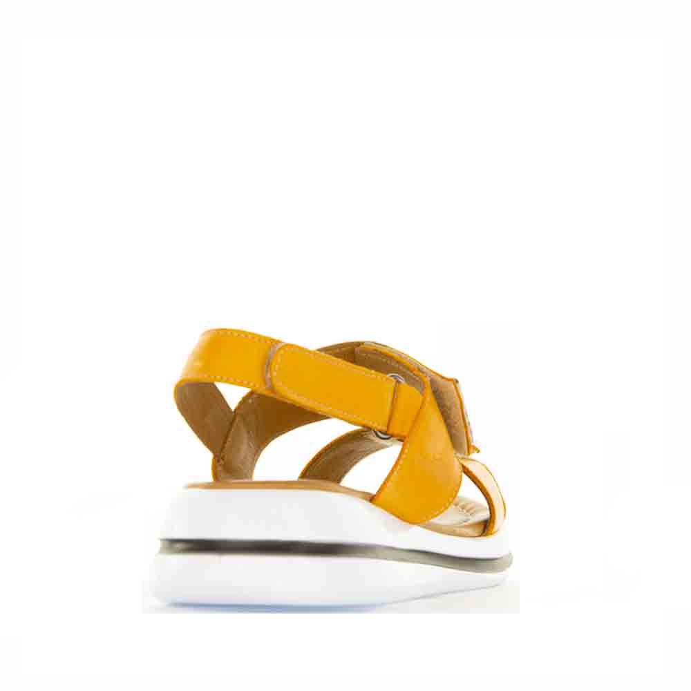 Le Sansa Sima orange sandals with open toe and strap design, perfect for casual summer wear.