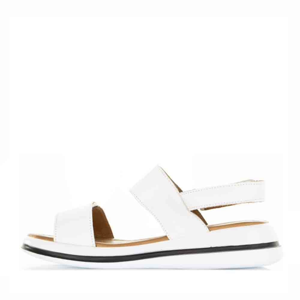 Le Sansa white Sima sandals with open toes and ankle straps, featuring a stylish design perfect for casual summer wear.