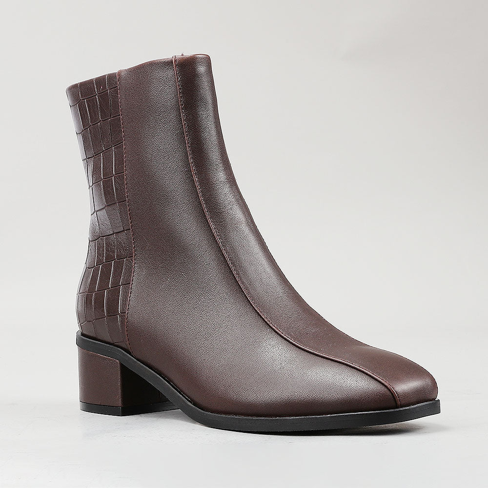 Le Sansa Spike Choco boots with chocolate-colored crocodile print, stylish and comfortable footwear for versatile fashion.