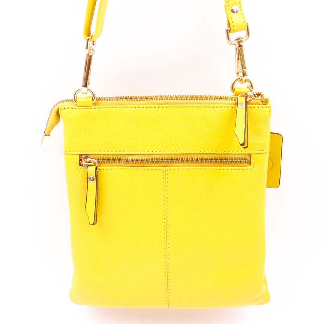 Second Nature Buttercup handbag with rounded design, cream-colored leather, and gold-tone hardware, stylish and elegant for everyday use.