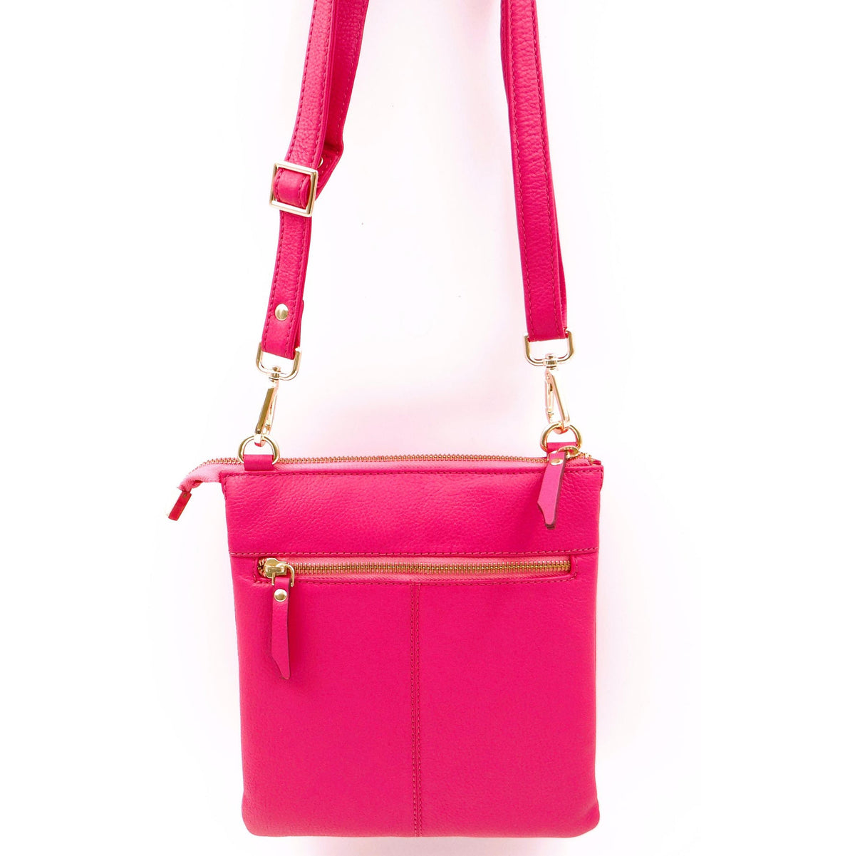 Second Nature Fuchsia handbag with sleek design, vibrant color, and structured shape, featuring a top handle and shoulder strap.