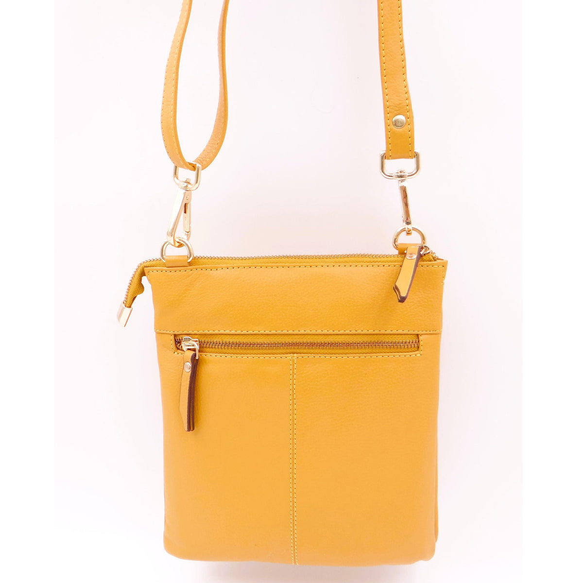 Second Nature ST31 saffron handbag with smooth leather texture and gold-tone hardware, showcasing its stylish design.