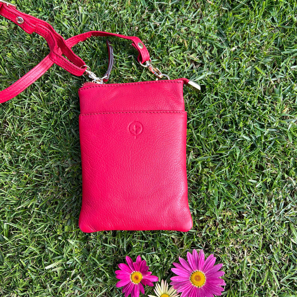 Red Second Nature handbag with sleek design and subtle branding, featuring a spacious interior and stylish finish.