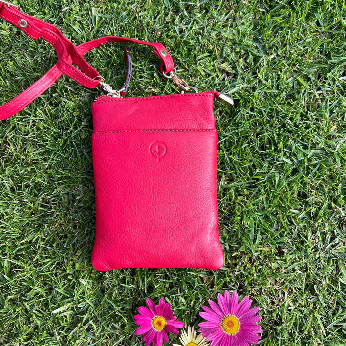Red Second Nature handbag with sleek design and subtle branding, featuring a spacious interior and stylish finish.