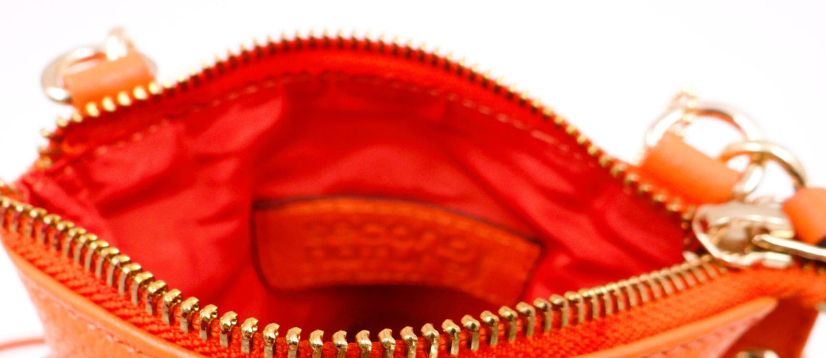 Orange Second Nature handbag with sleek design, featuring sturdy handles and modern style, perfect for casual or chic outfits.