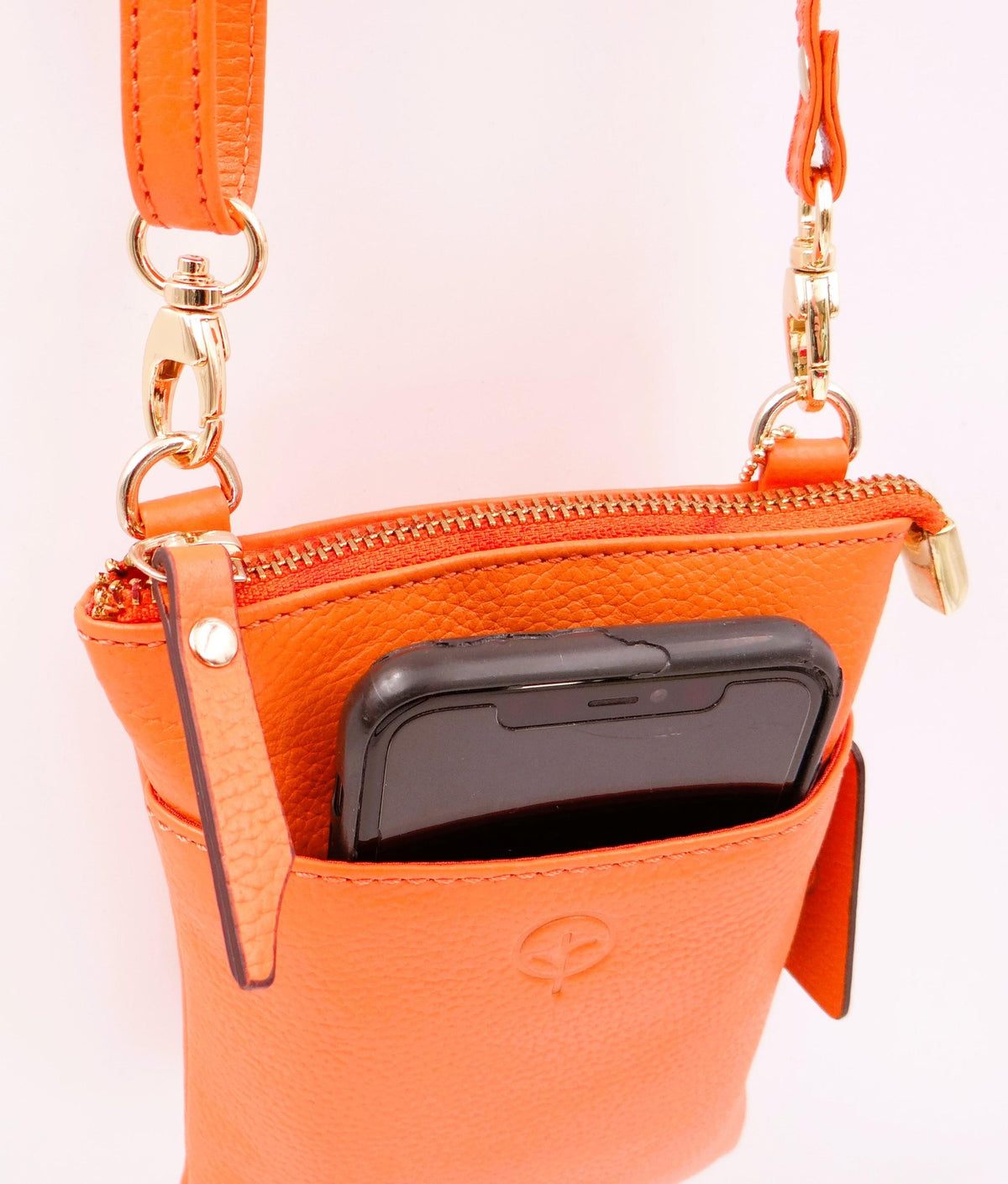 Orange Second Nature handbag with sleek design, featuring a structured shape and modern style.
