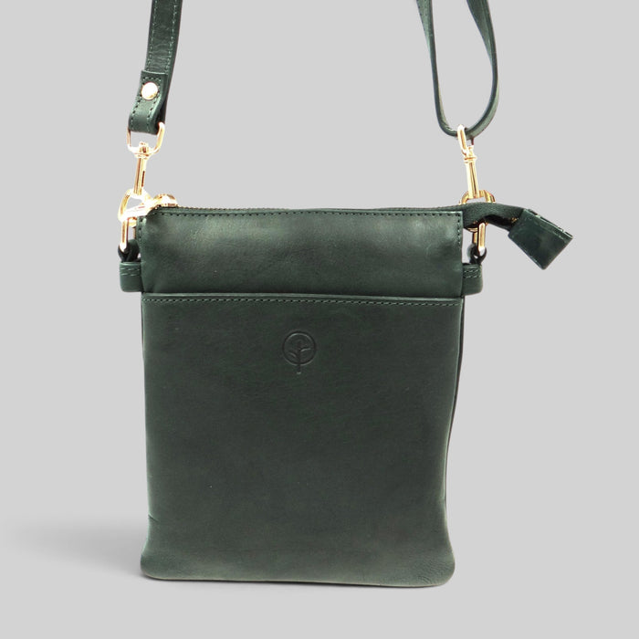Second Nature ST64 green bottle handbag with sleek design and adjustable strap, featuring a textured finish and stylish closure.