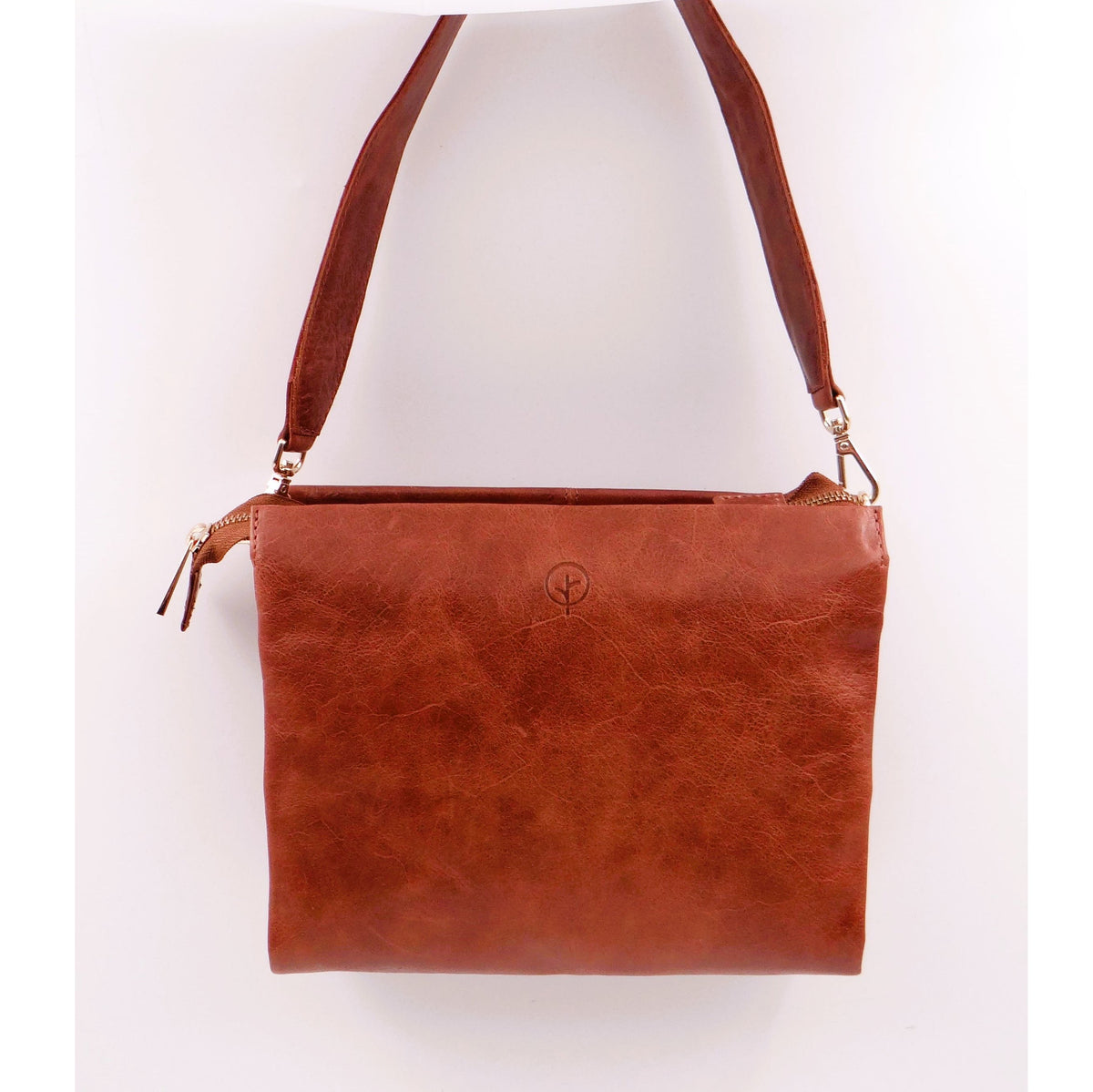 Second Nature ST82 tan handbag with sleek design, featuring a smooth leather finish and elegant hand strap.
