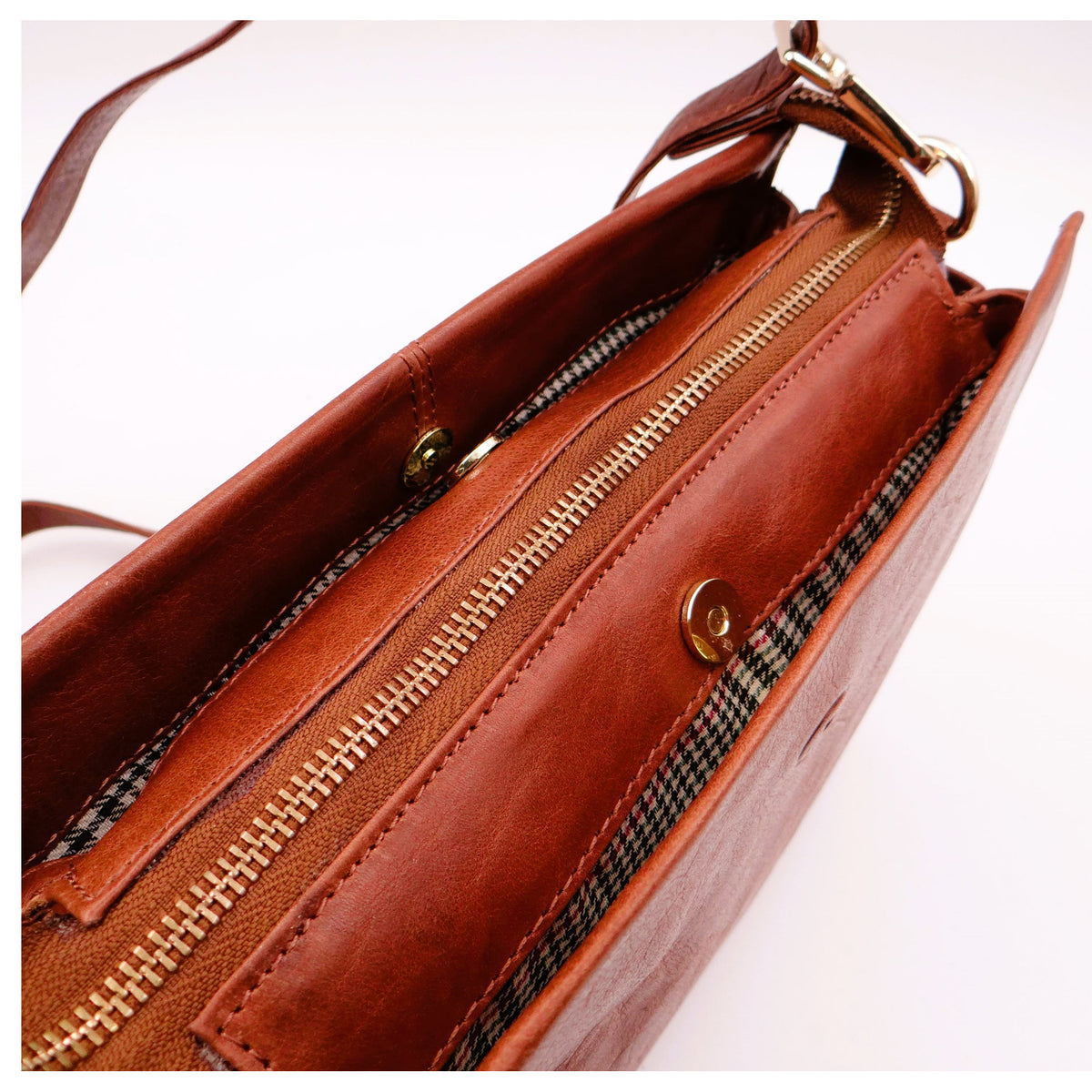 Second Nature ST82 Tan handbag showing textured leather exterior, top handles, and silver hardware details.