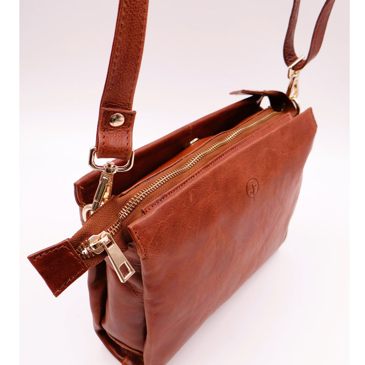 Tan Second Nature ST82 handbag with sleek design, featuring a structured shape and subtle stitching details.