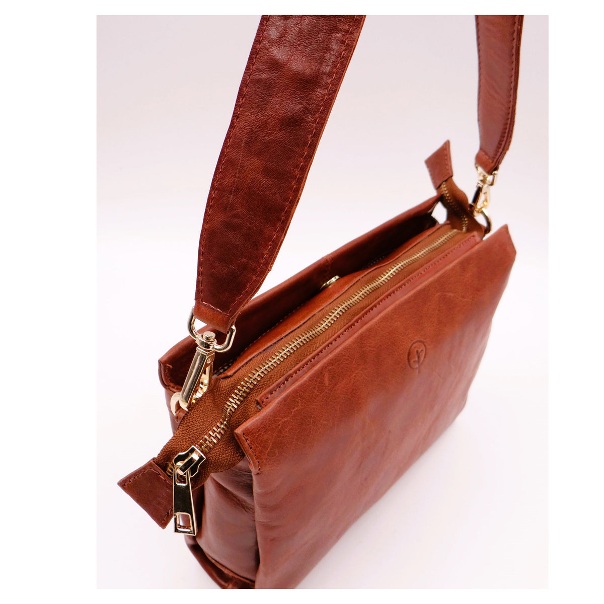 Second Nature ST82 Tan handbag with sleek design, featuring a smooth leather finish and stylish handles.