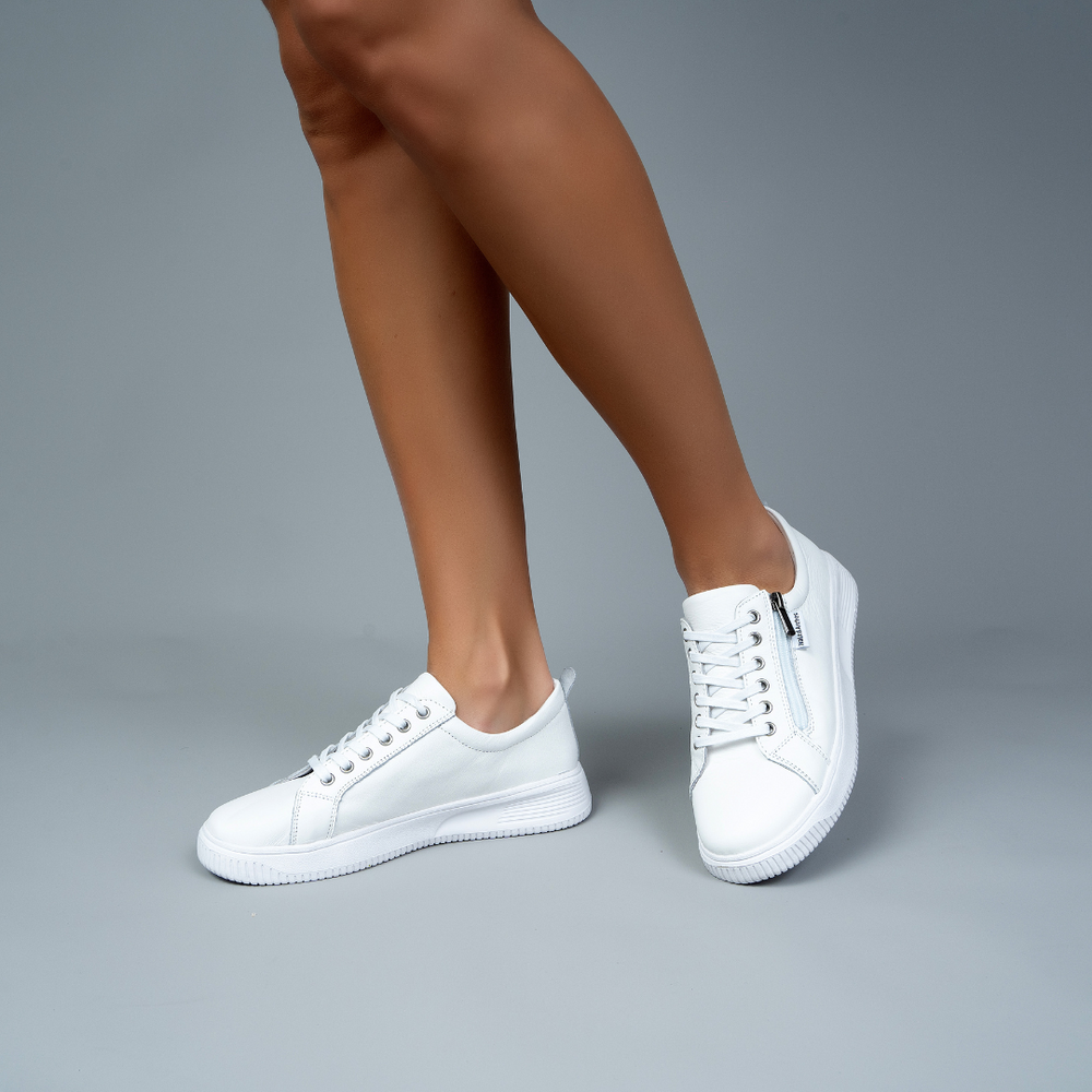 White Naked Arches Nelly Sneakers with stylish design and comfortable fit, shown from a front angle on a plain background.