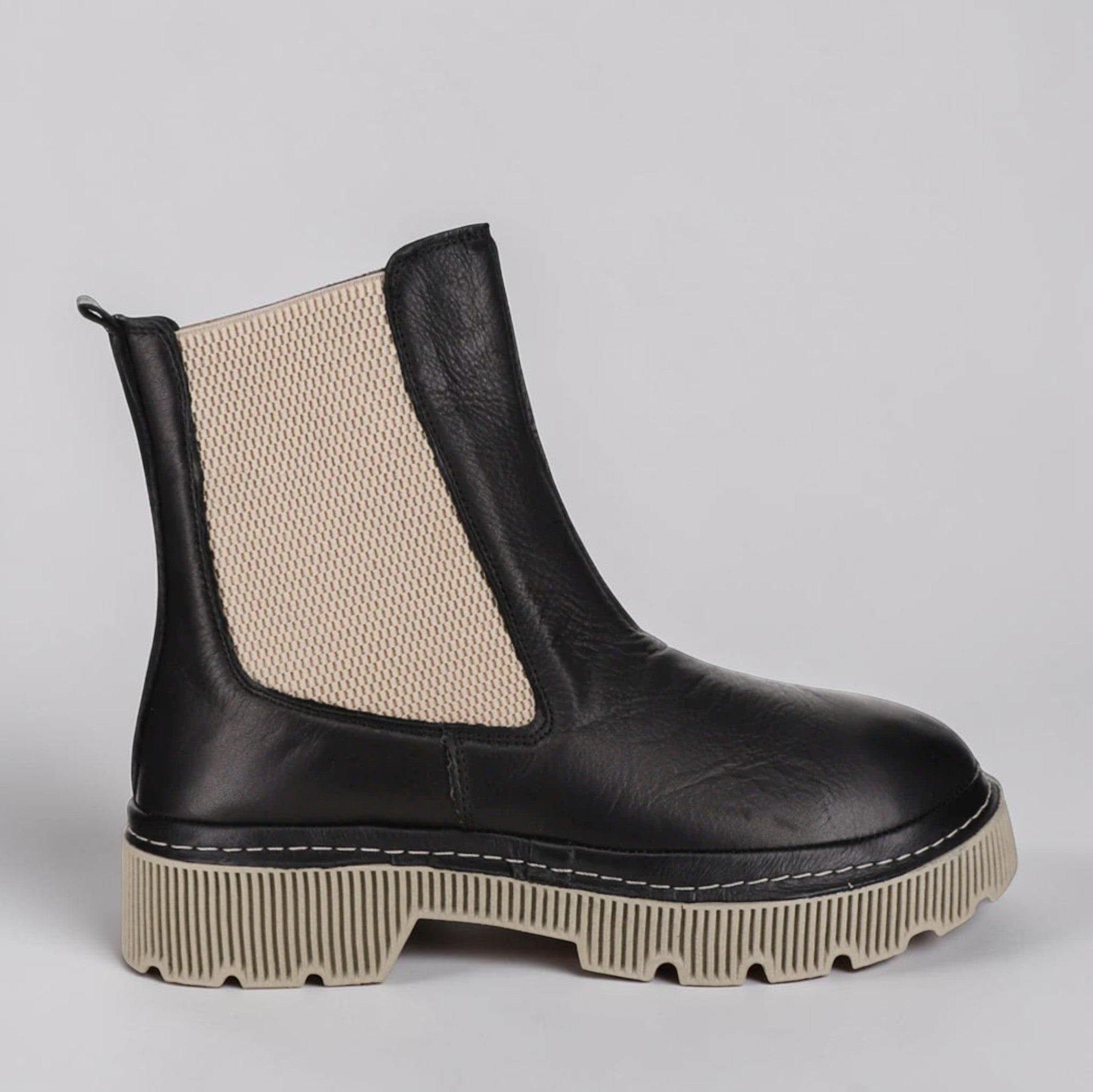 LE SANSA Lesansa Rose Black boots featuring sleek black leather, pointed toes, and stylish ankle-high design.