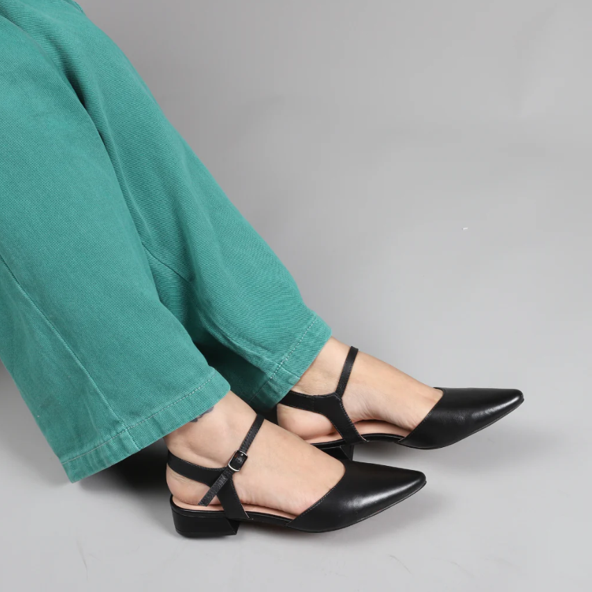 Black patent sandals from Le Sansa Coralie collection with a sleek strap design and open toe style.