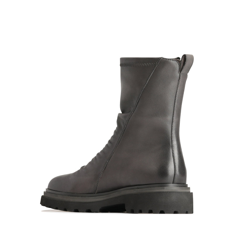 Eos Skarlet Iron boots with inside view showcasing black leather material and sleek design.