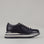 Le Sansa Skippa navy sneakers with white soles and laces, showcasing a stylish casual footwear design.