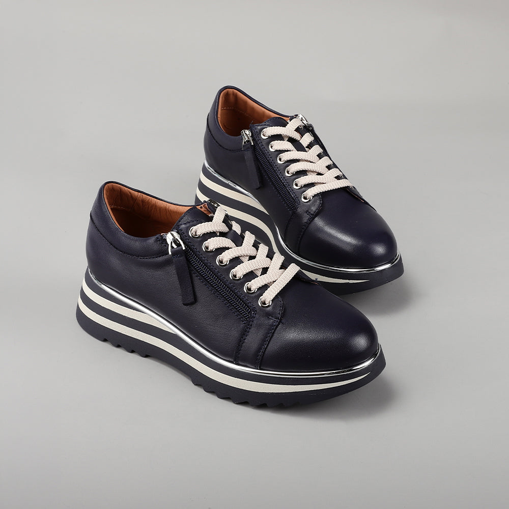 Le Sansa Skippa navy sneakers with white soles and laces, casual stylish footwear for everyday wear