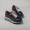 Le Sansa Skippa navy sneakers featuring white laces and a sleek, casual design perfect for everyday wear