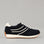 Black NAKED ARCHES Wednesday sneakers with sleek design and comfortable fit, shown on a plain background.