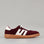 Le Sansa Juno Burgundy Ivory sneakers showing stylish leather design with burgundy and ivory color accents.