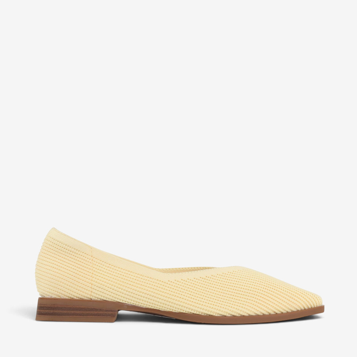 Los Cabos Syra Butter slip-on shoes featuring a sleek design and neutral color, perfect for casual wear.