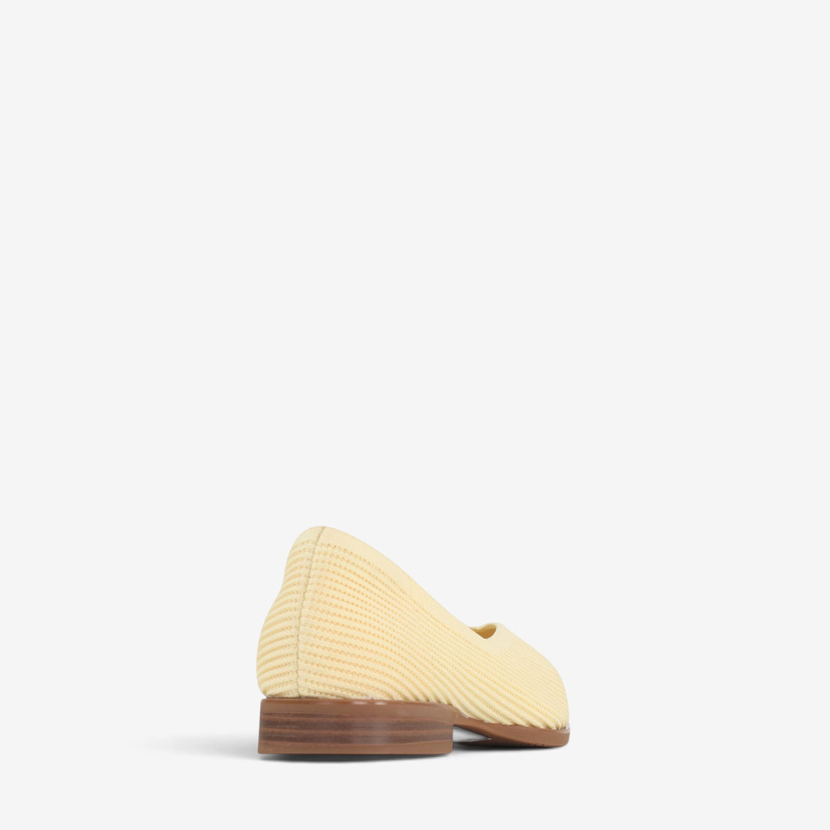 Los Cabos Syra Butter slip-on shoes featuring a sleek design and comfortable fit, shown in a stylish close-up image.