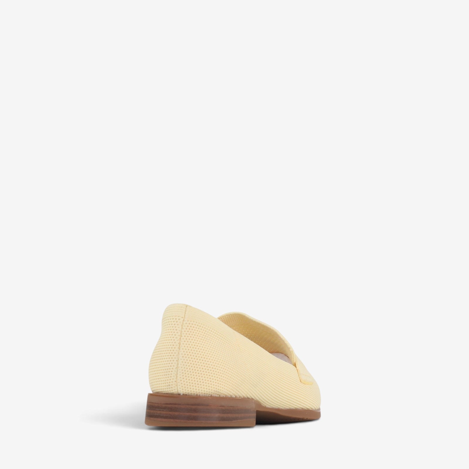 Pair of Los Cabos Syriana Butter slip-on shoes with a sleek design and neutral color, perfect for casual or dressy occasions.