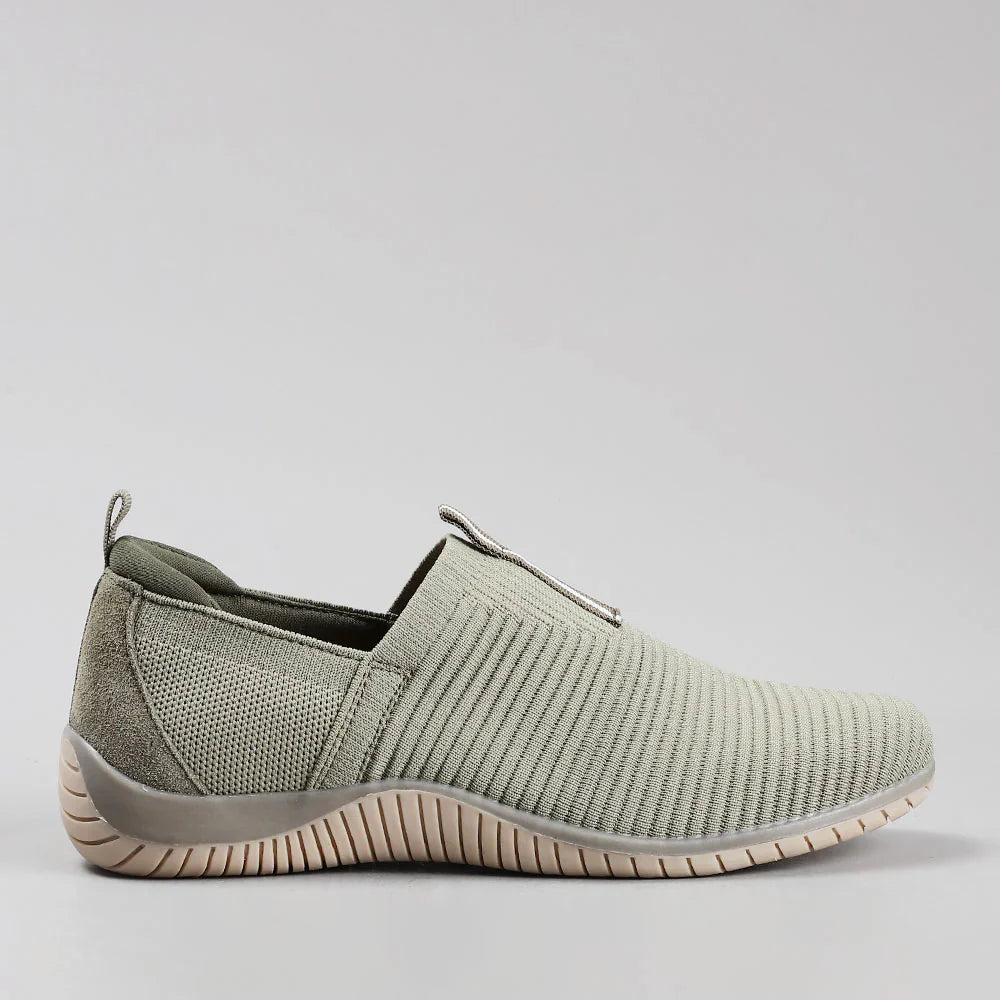 CC Resorts Tabitha slip-on shoes in khaki color, featuring a sleek design and comfortable fit, shown from the side view.