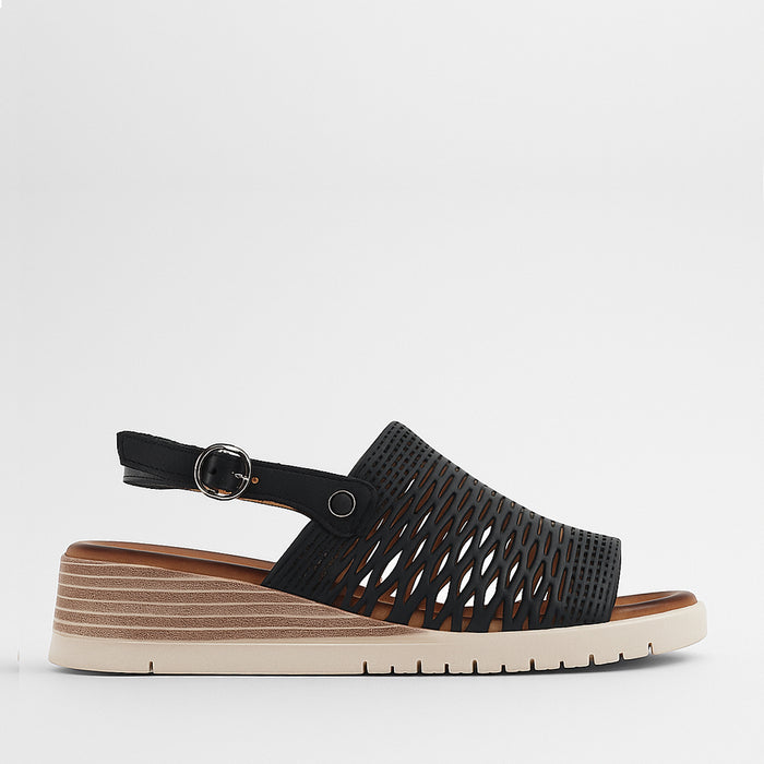 Le Sansa Topaz Black sandals with open toe design and ankle straps, featuring sleek black leather for stylish summer footwear.