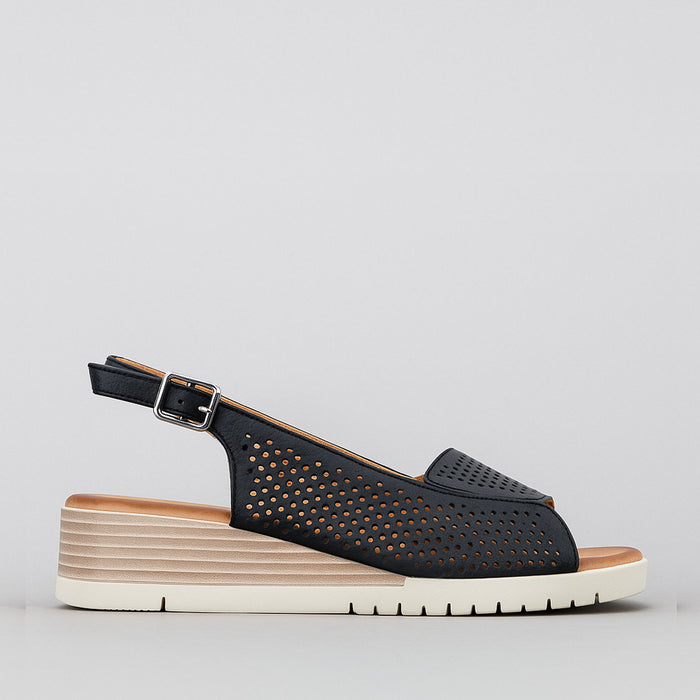 Le Sansa Terina black sandals with open toe design and ankle straps, featuring a stylish and comfortable slip-on style.