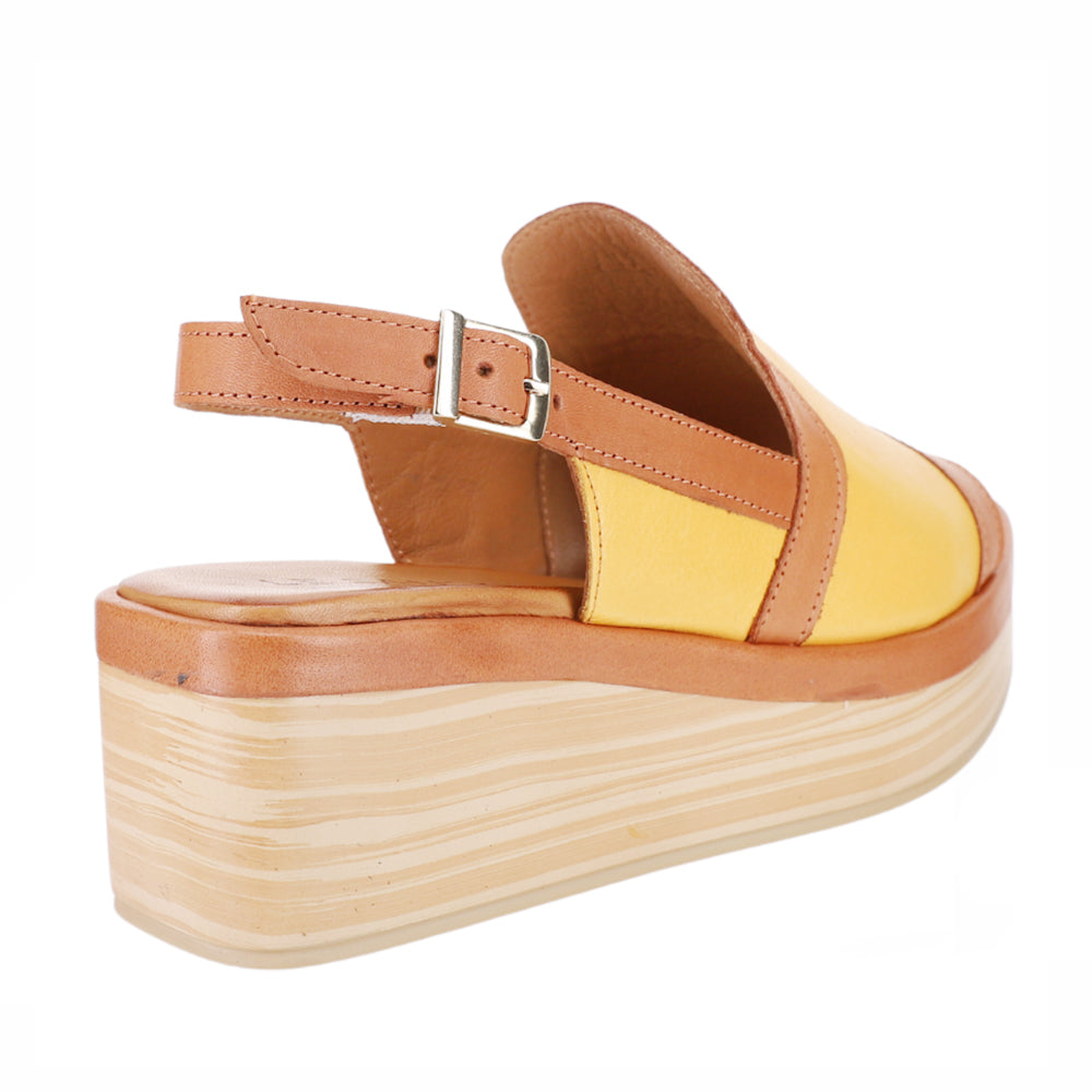 Le Sansa Trozan yellow tan sandals with open toes and ankle straps, showcasing a stylish summer footwear design.