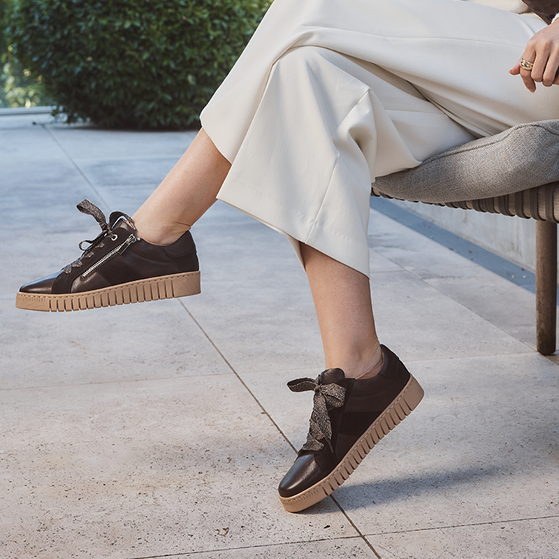 Close-up of EOS Tinah Mahogany sneakers showing the stylish design and mahogany-colored leather material.