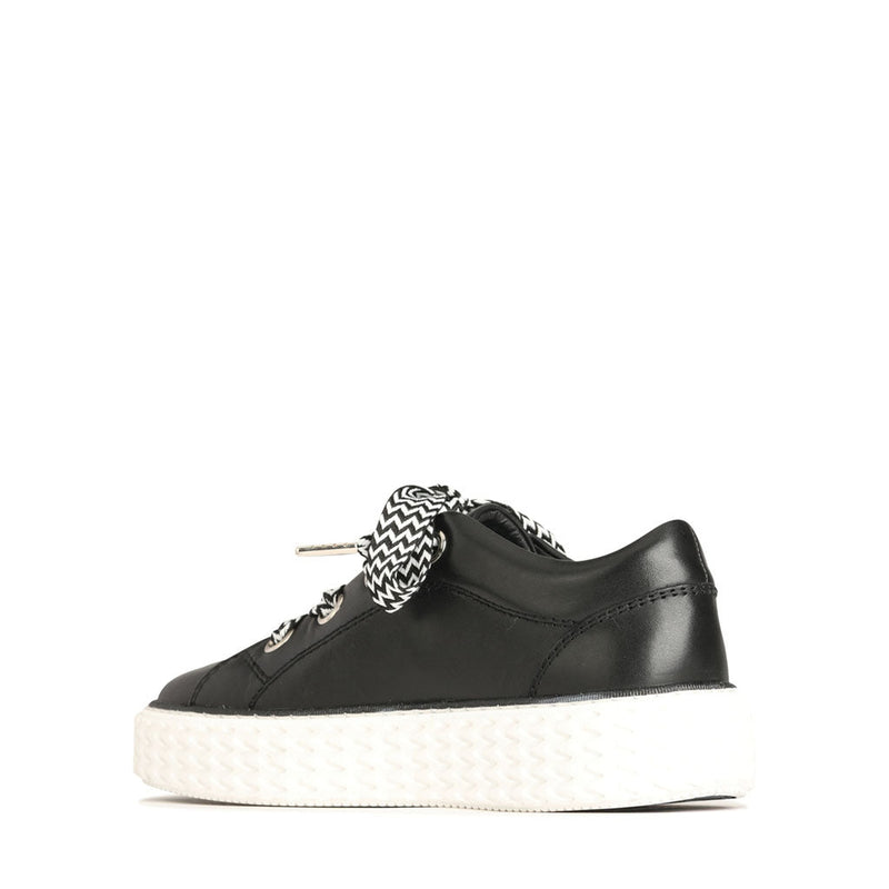 Eos Trinsic Black sneakers showing the inside view with black and white design details and comfortable interior lining