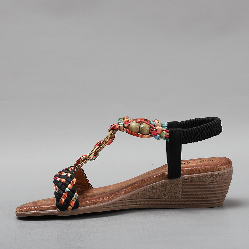 Black VS Treads URSA sandals with wide straps and chunky soles, displayed on a white background.
