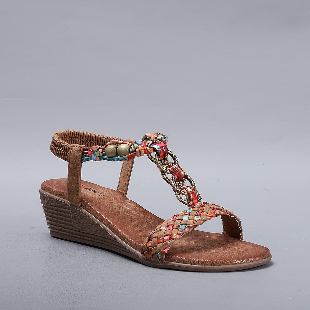 CC Resorts Ursa Tan sandals with tan straps and cushioned soles, displayed on a neutral background.