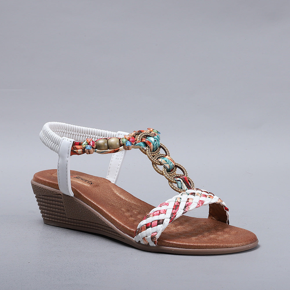 White CC Resorts Ursa sandals with strappy design and cushioned soles, perfect for casual summer wear.