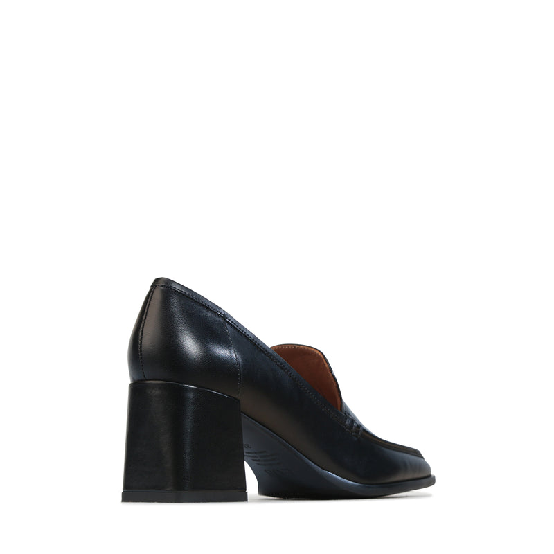 EOS VERDE BLACK heels featuring sleek black design with stylish strap details and elegant heel for dressy occasions.