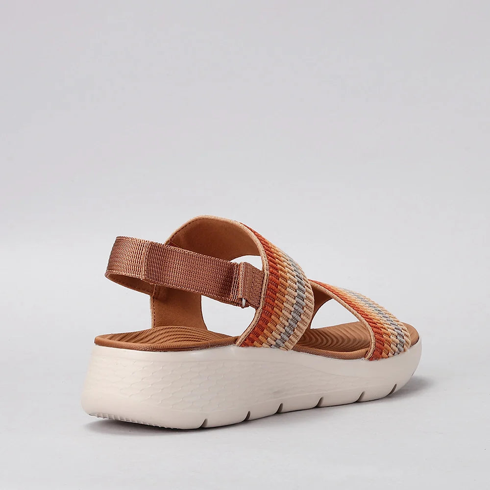 CC Resorts Welkin orange multi sandals with strappy design and flat sole, featuring bright orange and multicolor pattern.