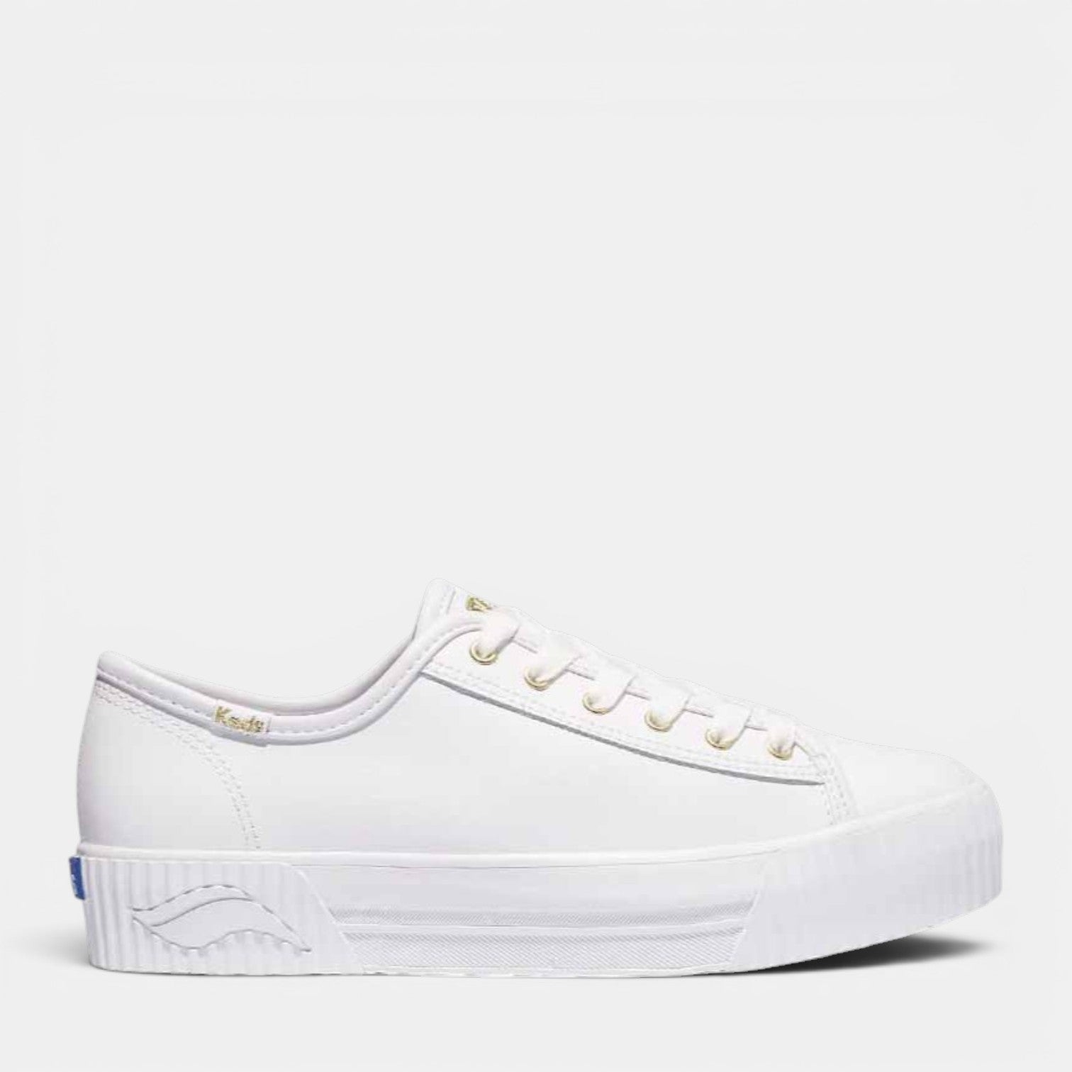 White KEDS Triple Kick Amp casual sneakers with leather uppers, featuring classic design and rubber soles.