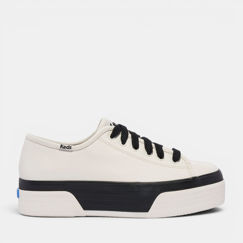 KEDS Triple Up women's sneakers in white and black leather with fox stripe detailing and bumper design.