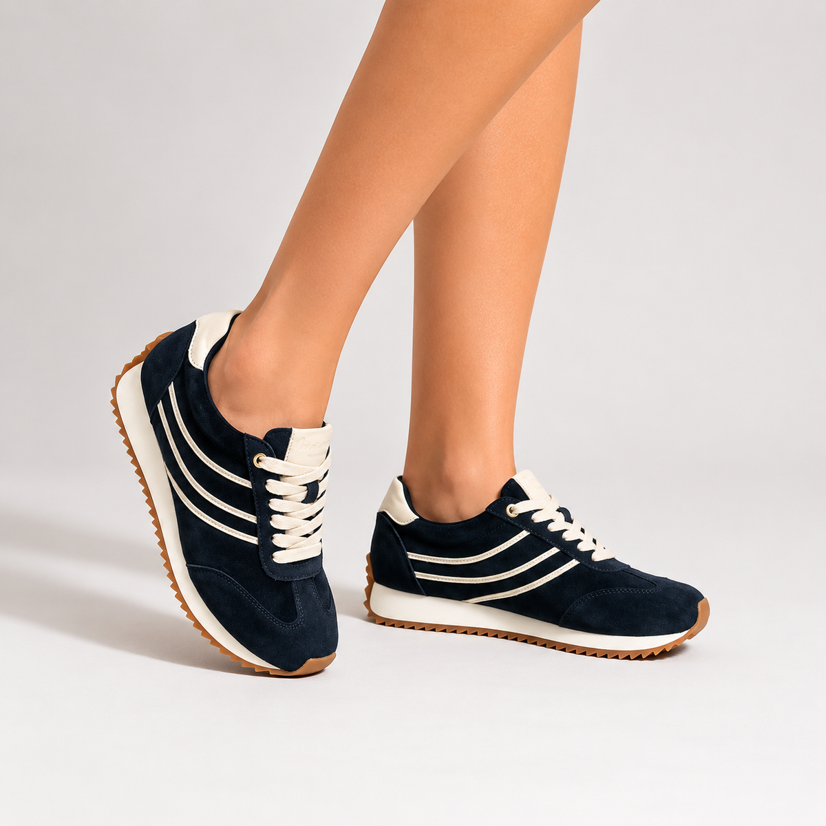Naked Arches Wednesday black sneakers with navy accents, featuring sleek design and comfortable fit for casual wear.