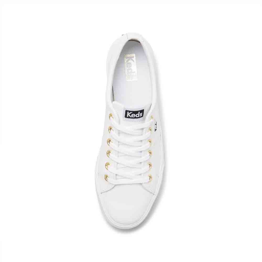 White KEDS Jump Kick Duo sneakers displayed on a clean surface, showcasing their classic design and white canvas material.